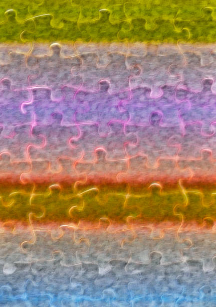Cardboard picture puzzle pieces given a multi-coloured, batik-like cloth treatment to make a variegated background.