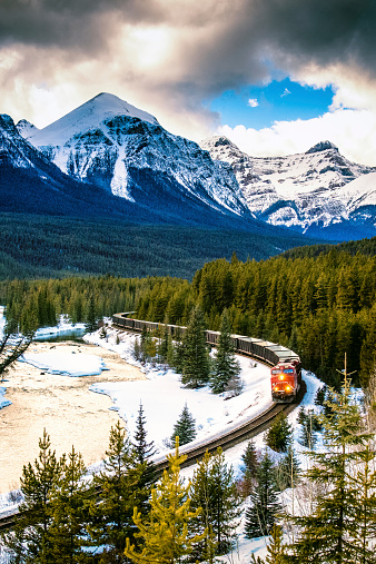 Canadian Pacific Railway Train through Banff National Park in winter. Canada.