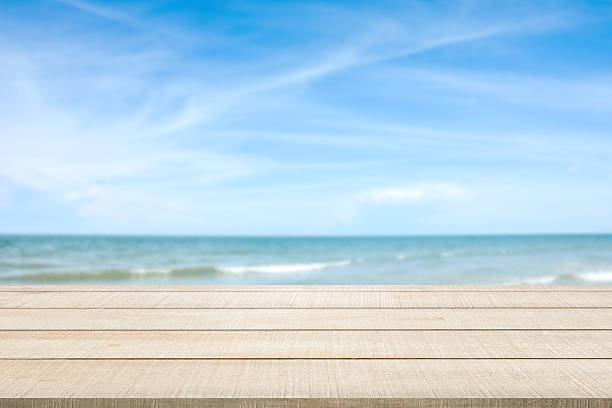 istock wood table top on blurred seascape 538813052
