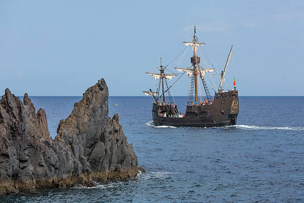 Tourists making a cruise with vessel "Santa Maria" at Madeira Funchal, Portugal - August 03 2014: Tourists making a cruise with a replica of vessel "Santa Maria" of Columbus near Funchal at Madeira Island, Portugal replica santa maria ship stock pictures, royalty-free photos & images
