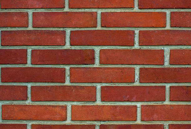 Wall made of brick Wall made of orange  brick with white joints. tarde stock pictures, royalty-free photos & images