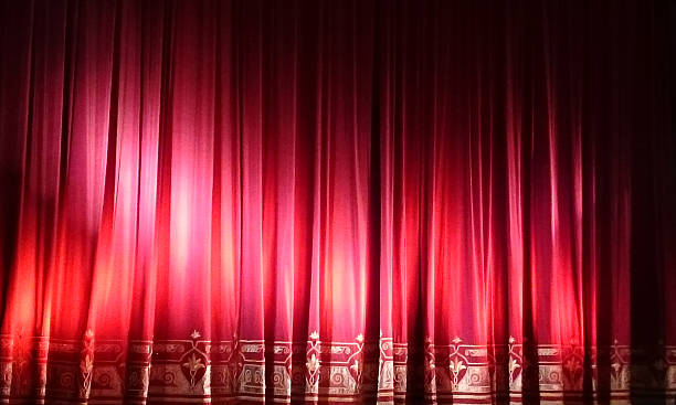 istock Closed red stage curtain in small theater. MobilStock 538827283