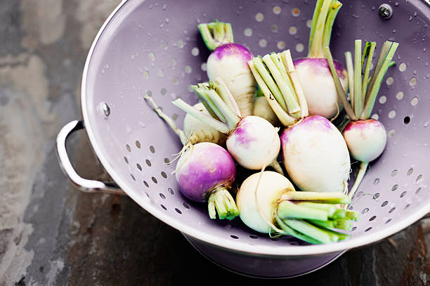 Turnips in a colander stock photo