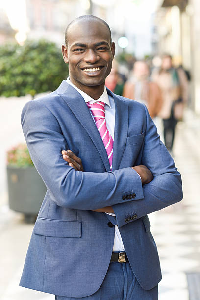 istock Handsome black man wearing suit in urban background 538827415