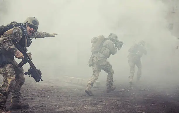 United States Army rangers during the military operation in the smoke and fire