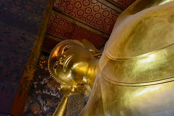 istock Reclining Buddha gold statue face. Wat Pho, Bangkok, Thailand 538829693