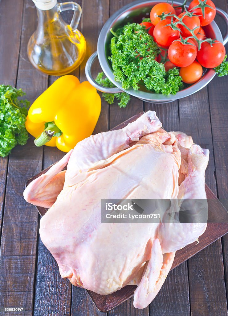 raw chicken raw chicken and fresh vegetables on a table 2015 Stock Photo