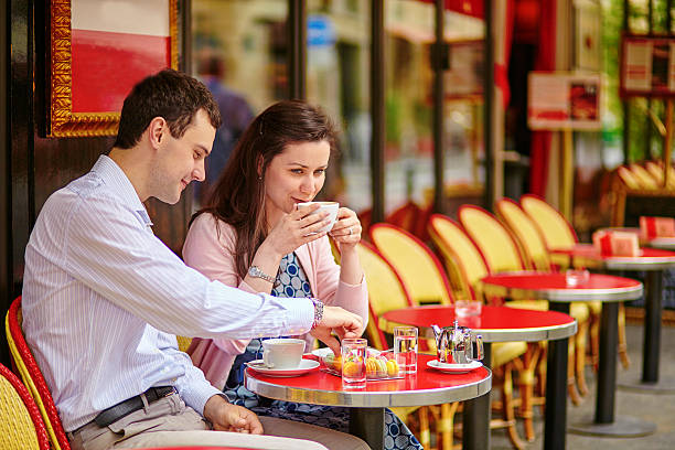 istock Couple drinking coffee or tea in a Parisian cafe 538837987