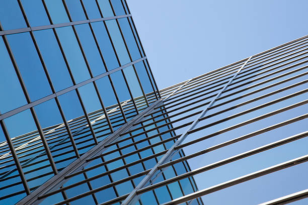 istock glass facade of office building and blue sky reflections 538838121