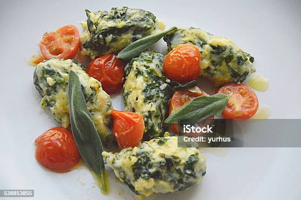 Spinach Gnocchi With Tomatoes And Salvia Stock Photo - Download Image Now - 2015, Cherry Tomato, Dinner