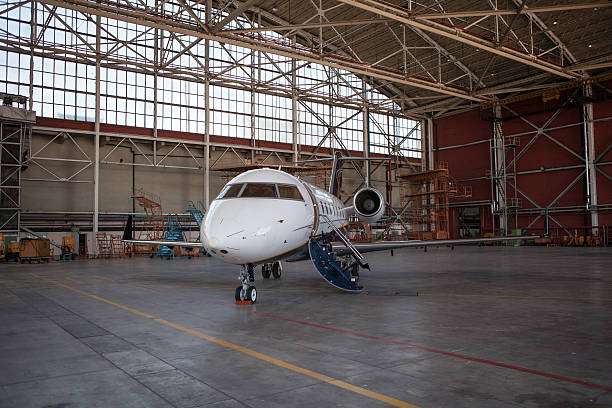 istock Business jet airplane stays in hangar. 538857267