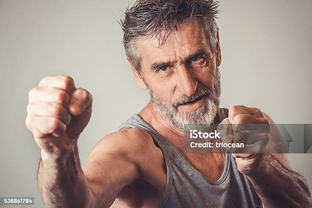 Senior Man In Fighting Position Stock Photo - Download Image Now - Men, Fist, Senior Men