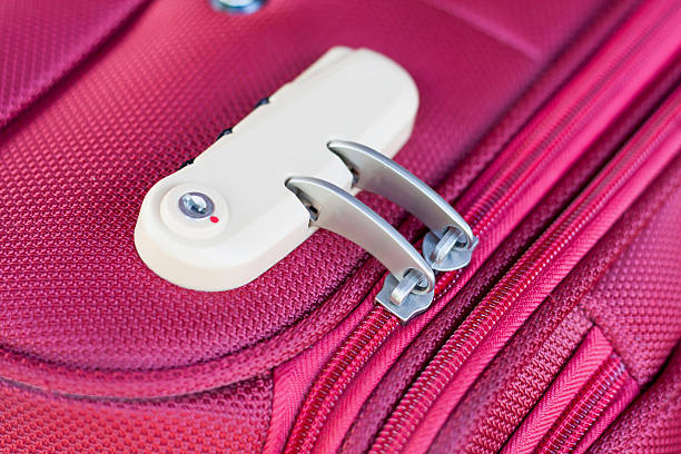 istock combination lock on red suitcase travel bag 538862758