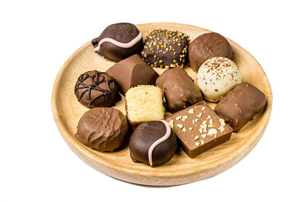 istock Assorted kind of chocolates on a wooden plate 538863308