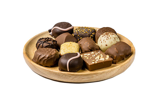 istock Assorted kind of chocolates on a wooden plate 538863338