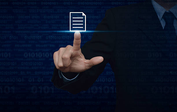 Businessman pressing document icon over computer binary code blue background stock photo