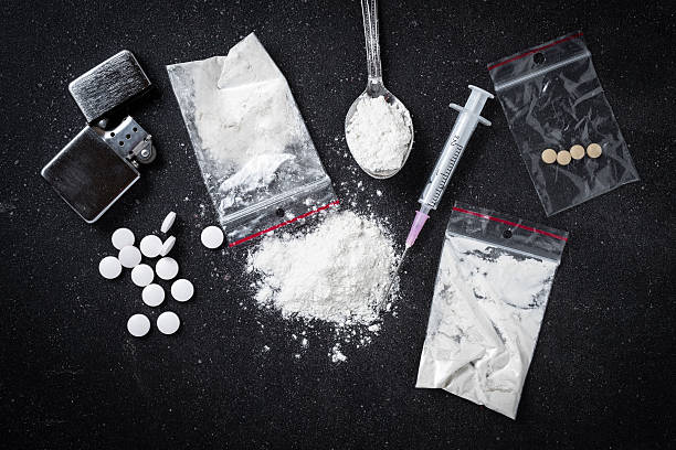 Hard drugs on dark table Hard drugs on dark table. Close up narcotic stock pictures, royalty-free photos & images