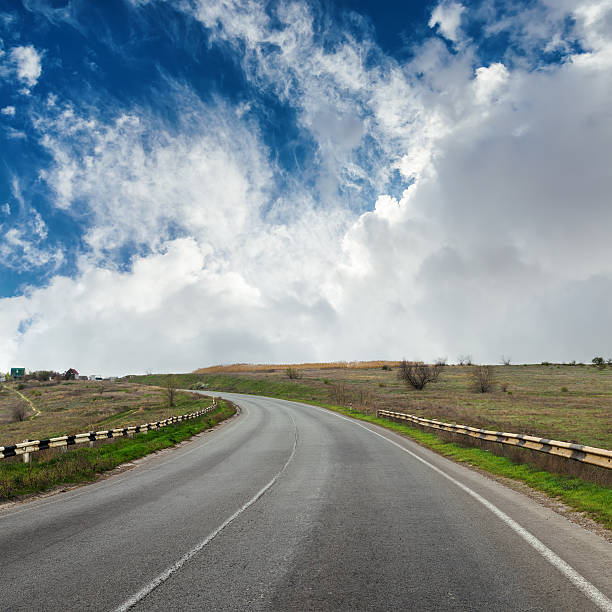 istock asphalt road to horizon in dramatic sky 538871060