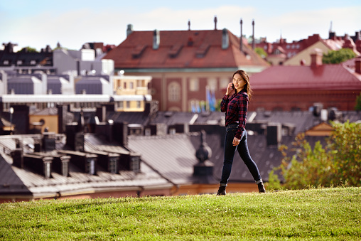 Woman in Stockholm, city in background