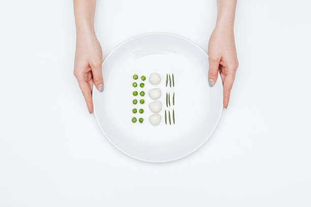 istock Top view of plate with green peas, mozzarella and herbs 538873862