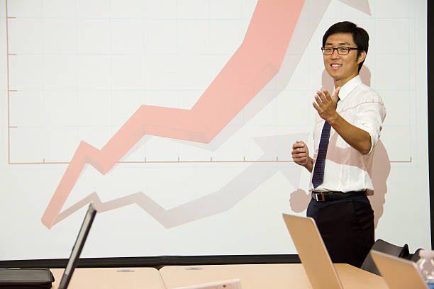 istock Presenter is presenting & students are working Classroom international style 538876235
