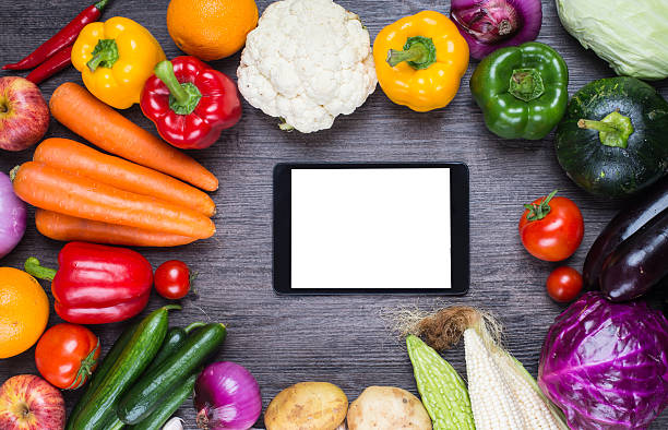 istock different fruits and vegetables on old wooden table 538877056