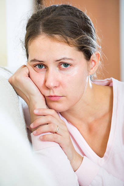 istock upset woman sitting in domestic interior 538878576