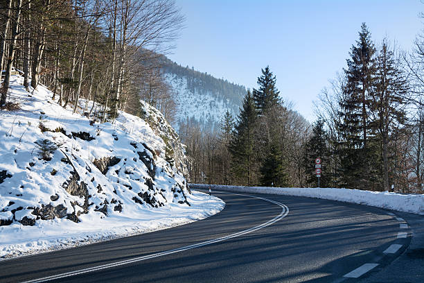 istock curvy mountain road, winter landscape 538879307