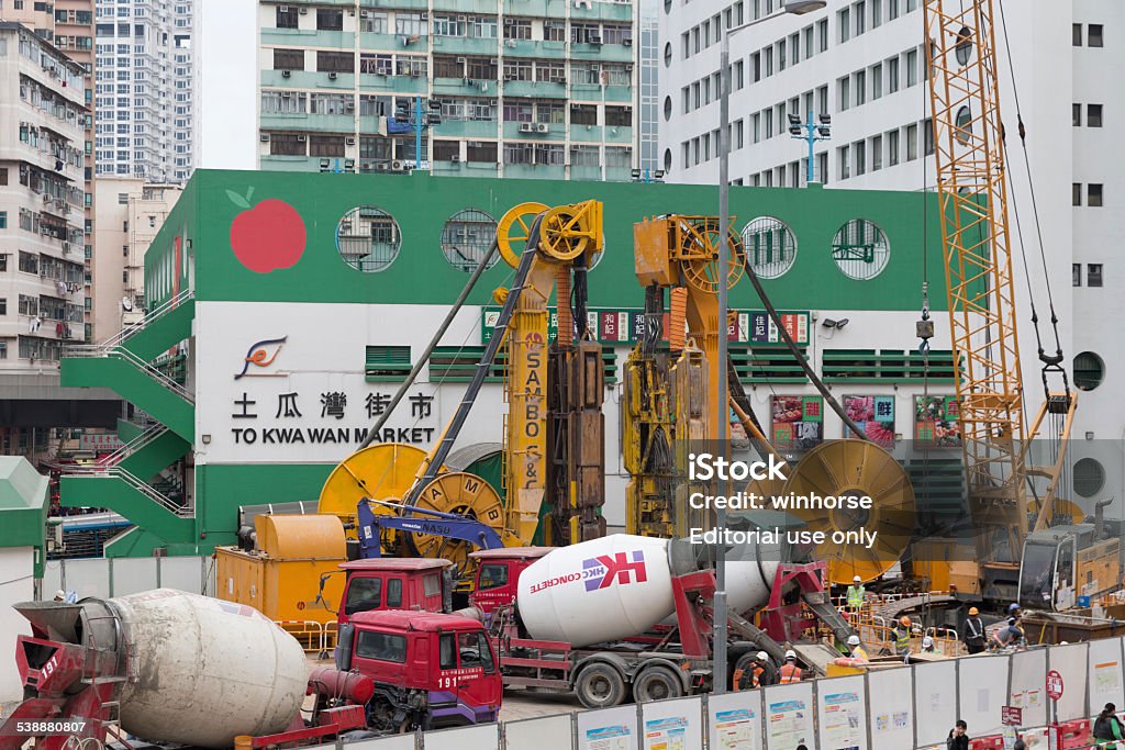 MTR Tuen Ma Line To Kwa Wan Station Construction Site in Hong Kong Hong Kong - February 25, 2013 : Construction workers at the MTR Tuen Ma Line To Kwa Wan Station construction site in Kowloon, Hong Kong. The Tuen Ma Line is the longest railway line in Hong Kong running approximately 56 km with 27 stations. 2015 Stock Photo