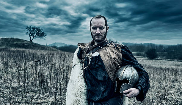 istock Warlord stands on the battlefield holding helmet 538881057