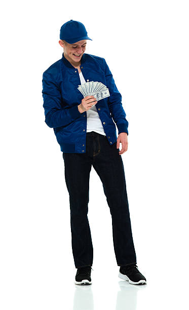 istock Cheerful male holding money 538881356