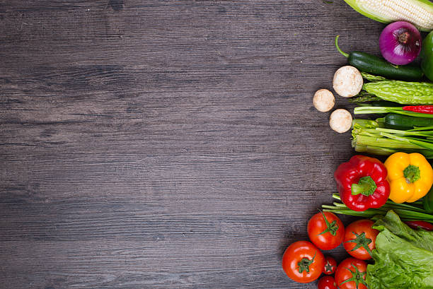 istock different fruits and vegetables on old wooden table 538882406