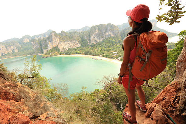 istock young woman rock climber climbing at seaside mountain cliff 538882900