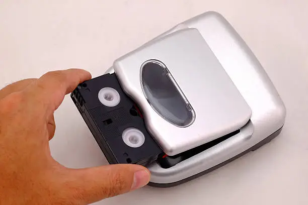 Photo of mini DV Cassette and  mini DV Cassette Rewinder
