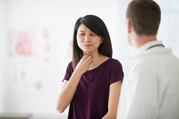 istock Telling a Doctor About Her Sore Throat 538888088