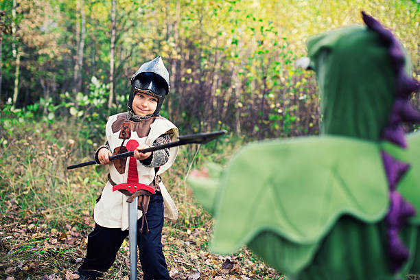 istock Little knight fighting with green dragon. 538888570