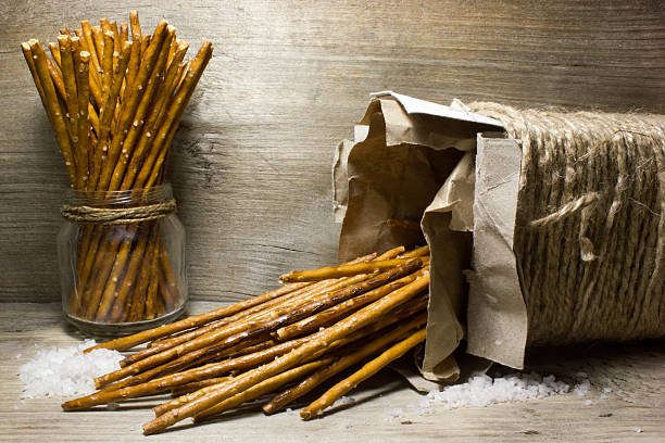 istock Bread sticks with salt in Kraft box on wooden background 538890326