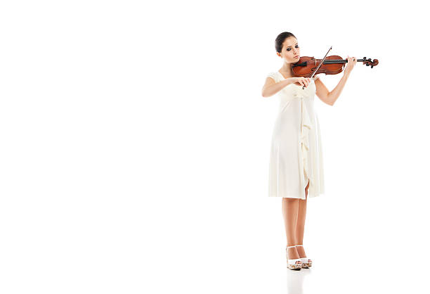 istock Beautiful young woman playing violin over white 538891166