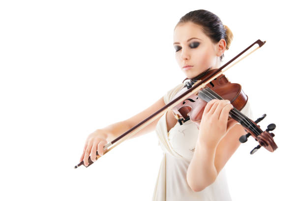 istock Beautiful young woman playing violin over white 538891462