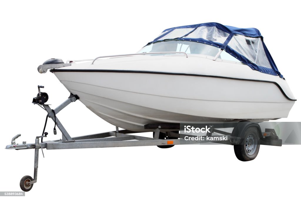 White motor boat. White motor boat loaded on the trailer for transportation. Business Finance and Industry Stock Photo