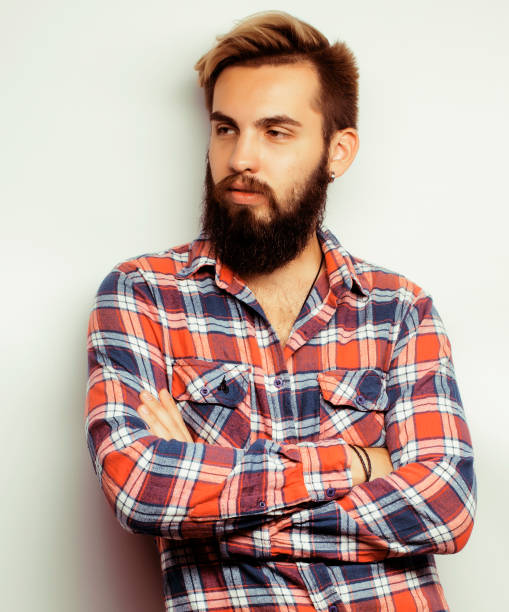 istock portrait of young bearded hipster guy smiling on white background 538894656