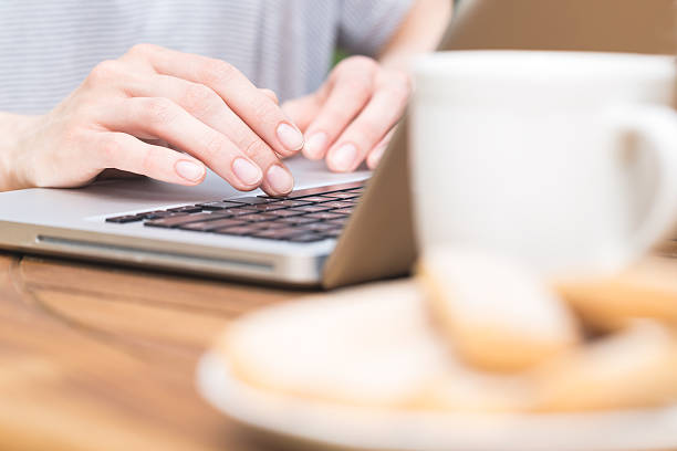 istock Woman using laptop outdoor. Close-up hands 538895020