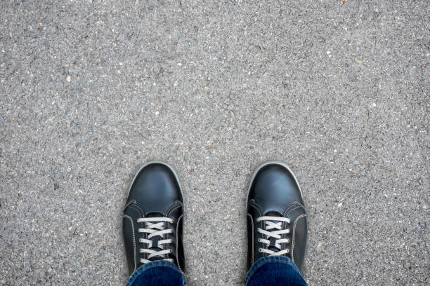 istock Black casual shoes standing on concrete floor 538895762