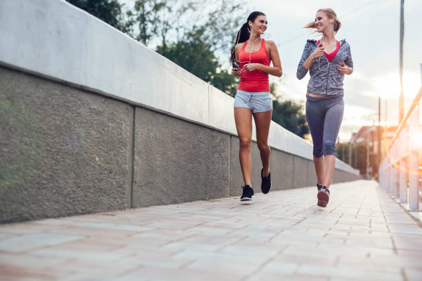 istock Women jogging in city in dusk 538895908