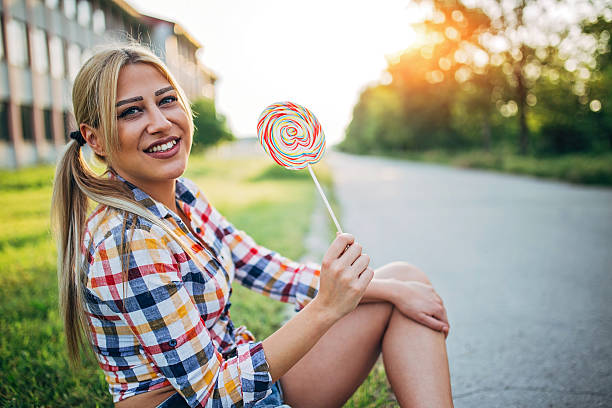 istock Beautiful lady with lollipop 538896164