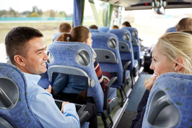 group of happy passengers in travel bus transport, tourism, road trip and people concept - group of happy passengers or tourists in travel bus coach bus photos stock pictures, royalty-free photos & images
