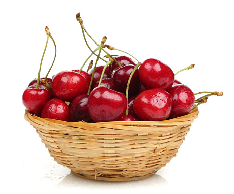 A basket full of sweet red cherries