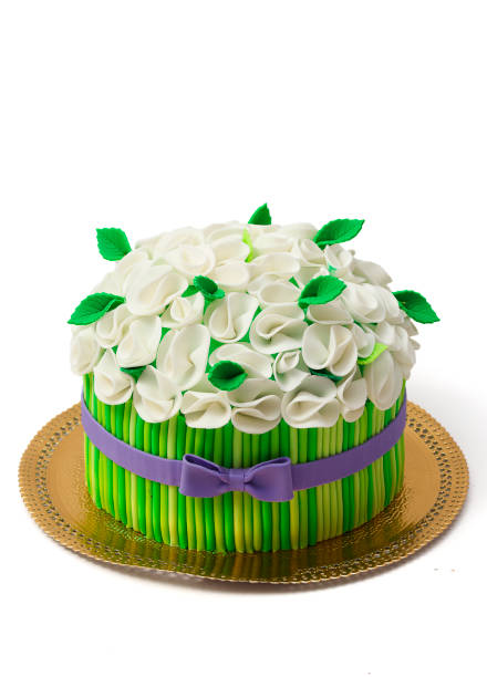 istock Green festive cake isolated on white background 538898492