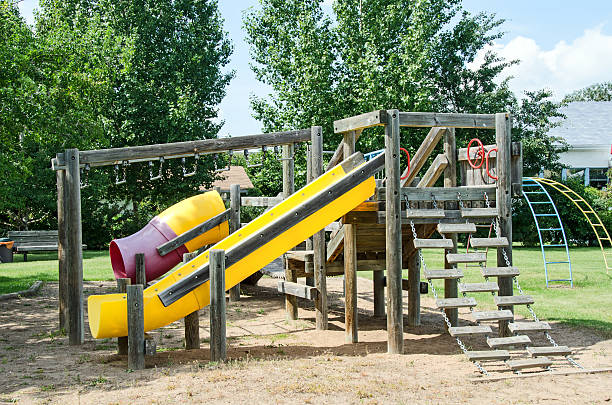 istock Older rural community playground equipment including slides 538898824