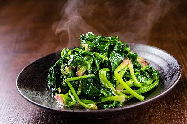 Fried Spinach Fried Spinach stir fried stock pictures, royalty-free photos & images